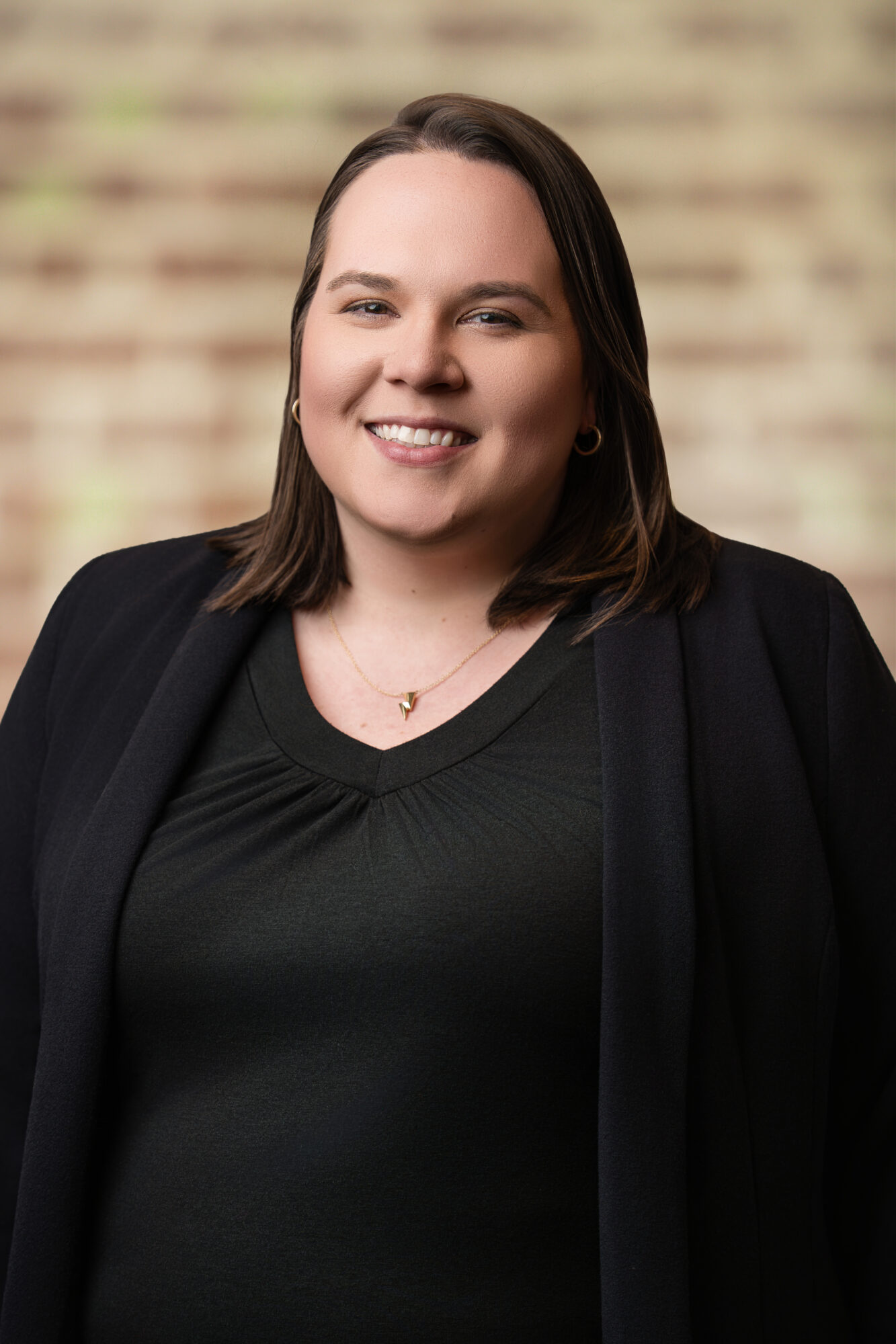 Tiffany Howlett, Operations Coordinator at Jones Aur Commercial Real Estate, smiling in a professional setting, emphasizing expertise in Memphis commercial real estate and operational efficiency.